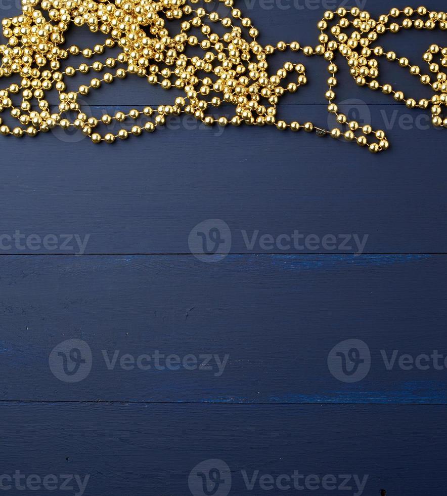 Christmas garland of round golden beads strung on a string photo