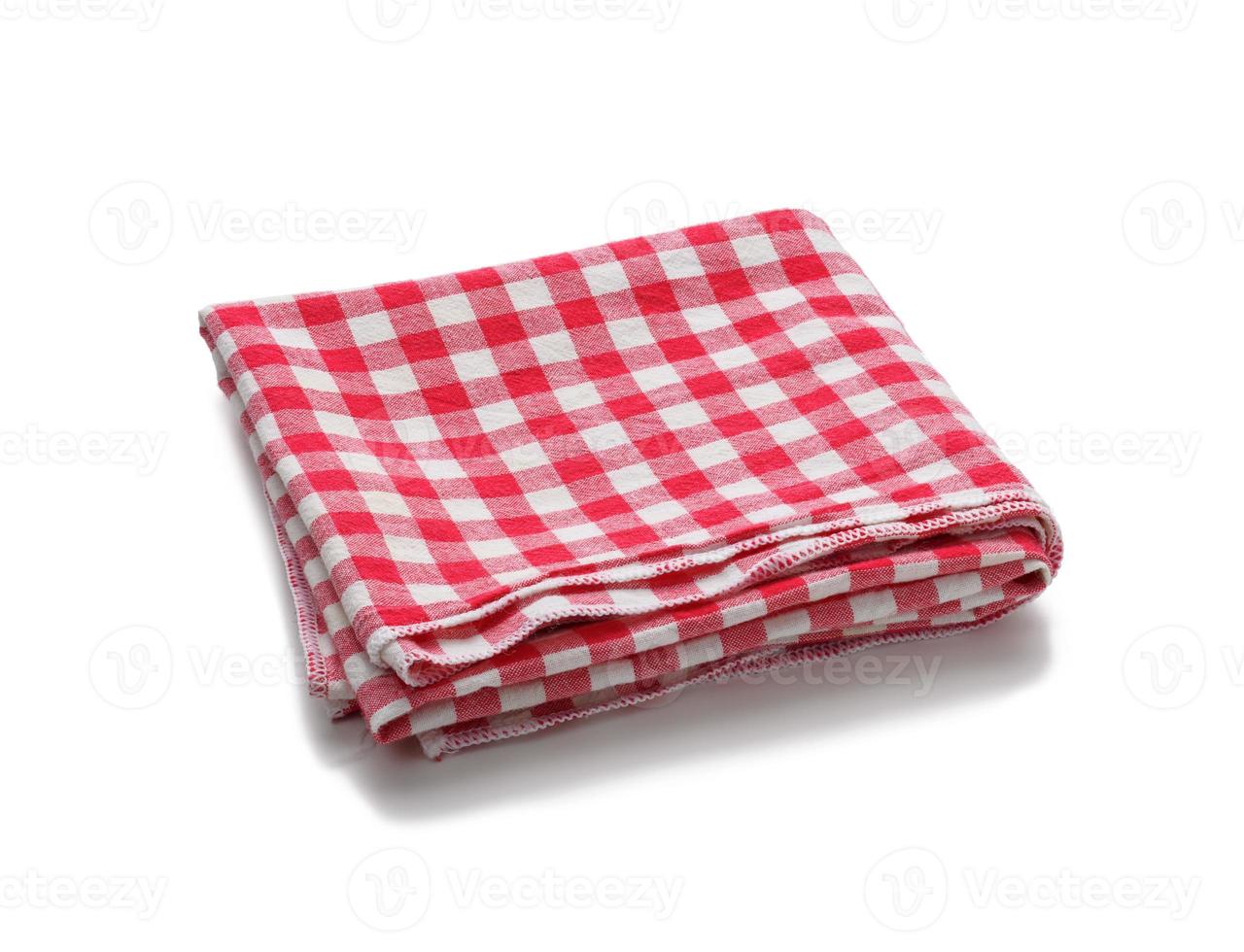 folded cotton red white checkered napkin on a white background photo