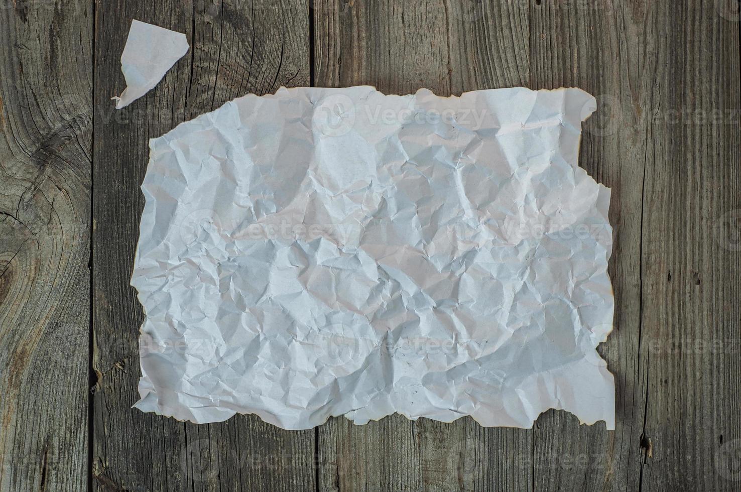Empty white crumpled sheet with a torn off edge photo
