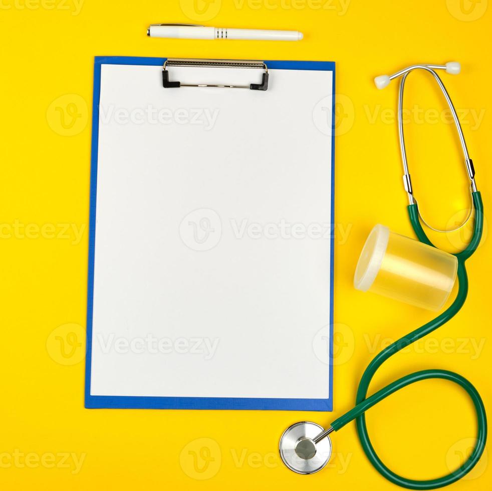 empty white sheets and medical stethoscope photo
