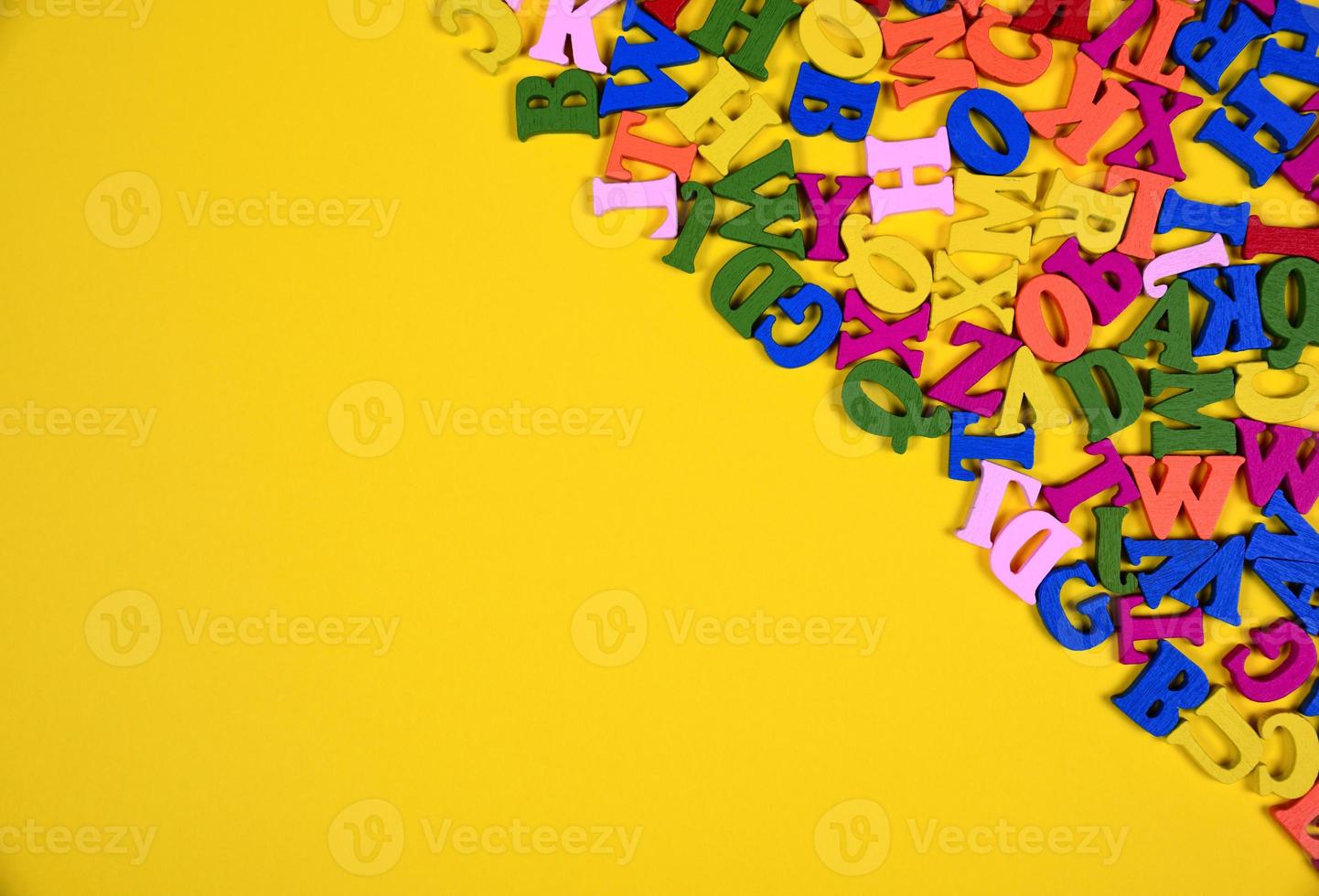 Multicolored wooden letters of the English alphabet photo