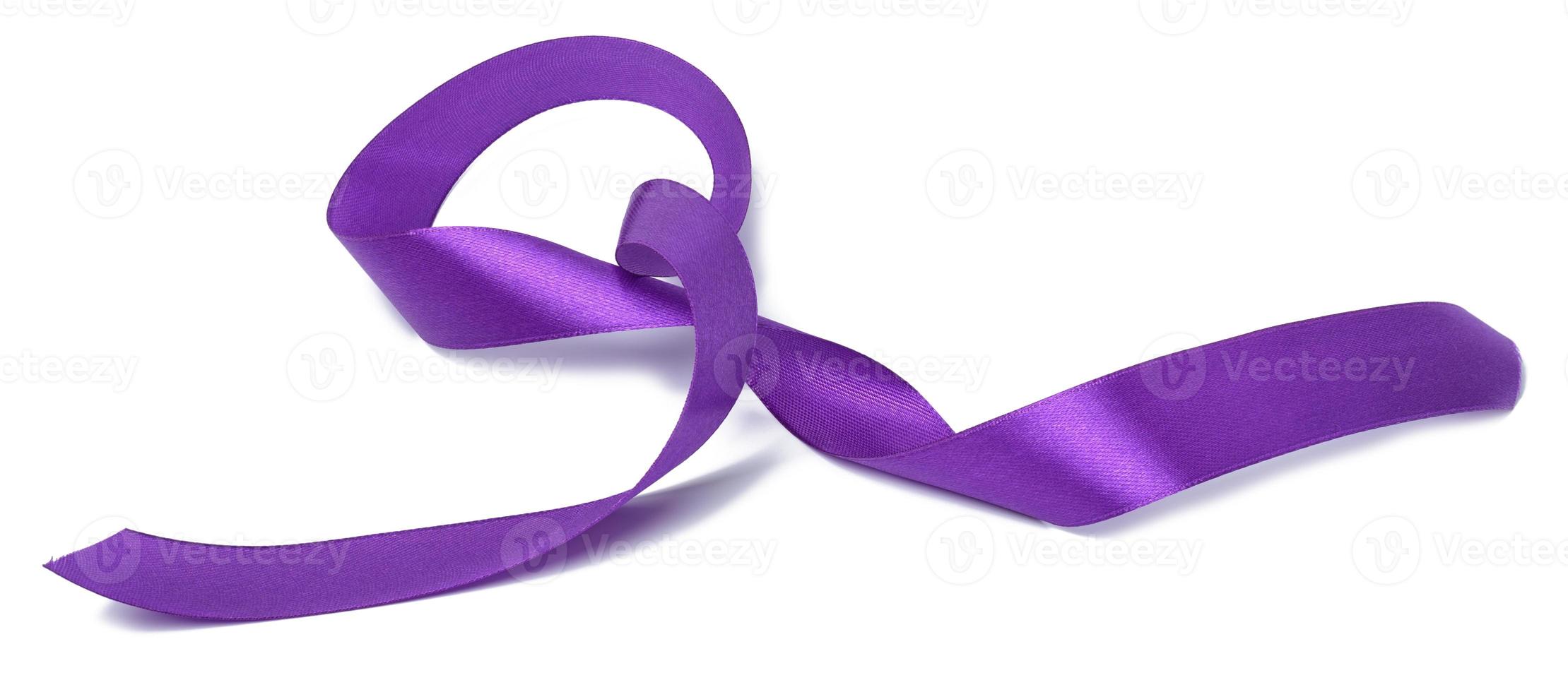 Rolled up silk purple ribbon isolated on white background photo