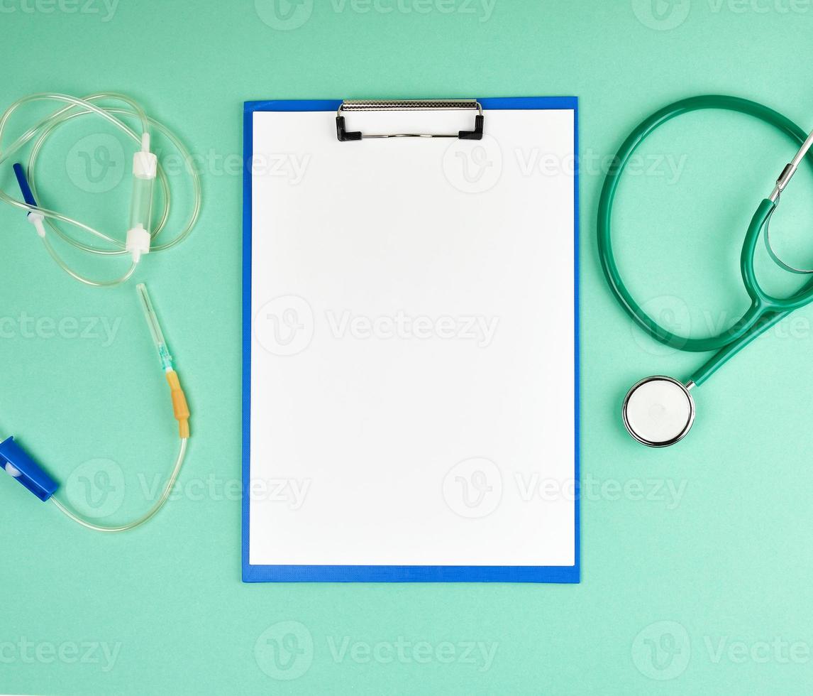 empty white sheets and  medical stethoscope photo