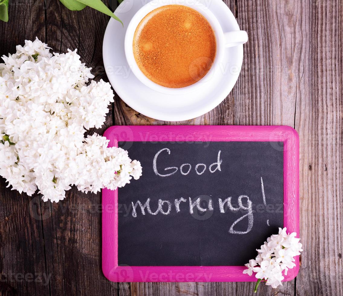 black chalk plaque in a pink frame with an inscription good morning photo