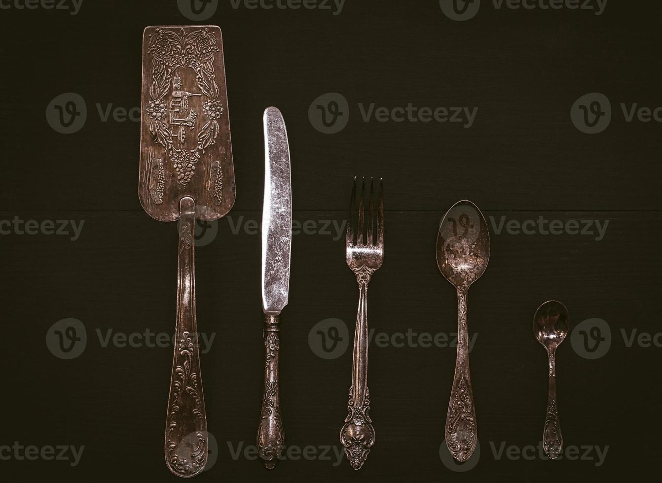 Kitchen accessories on a black wooden surface photo