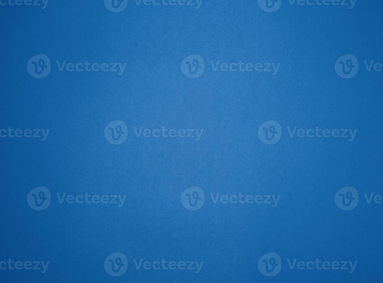 empty blue paper background with vignette, place for an inscription photo