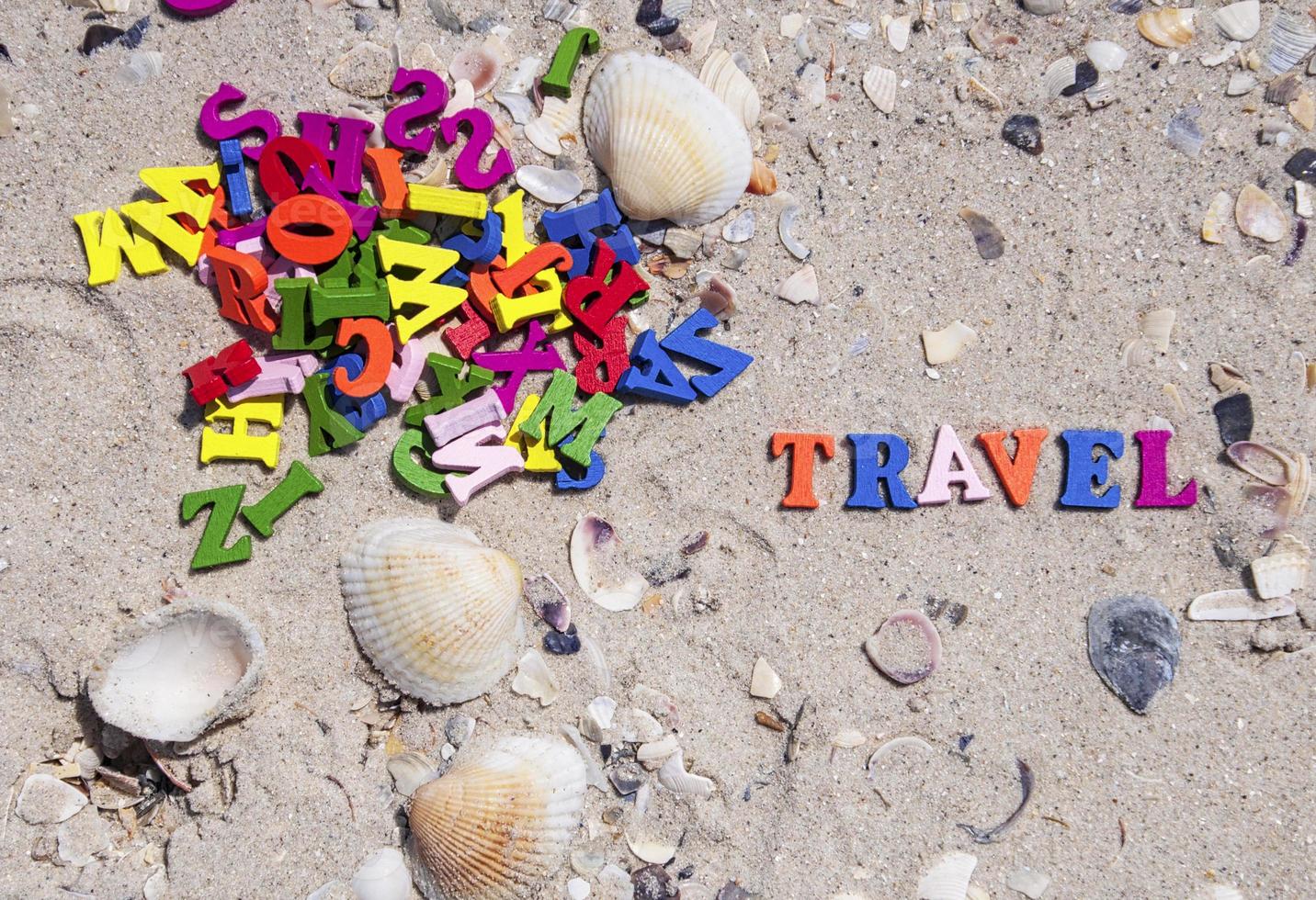 word travel is made up of small multicolored  letters photo