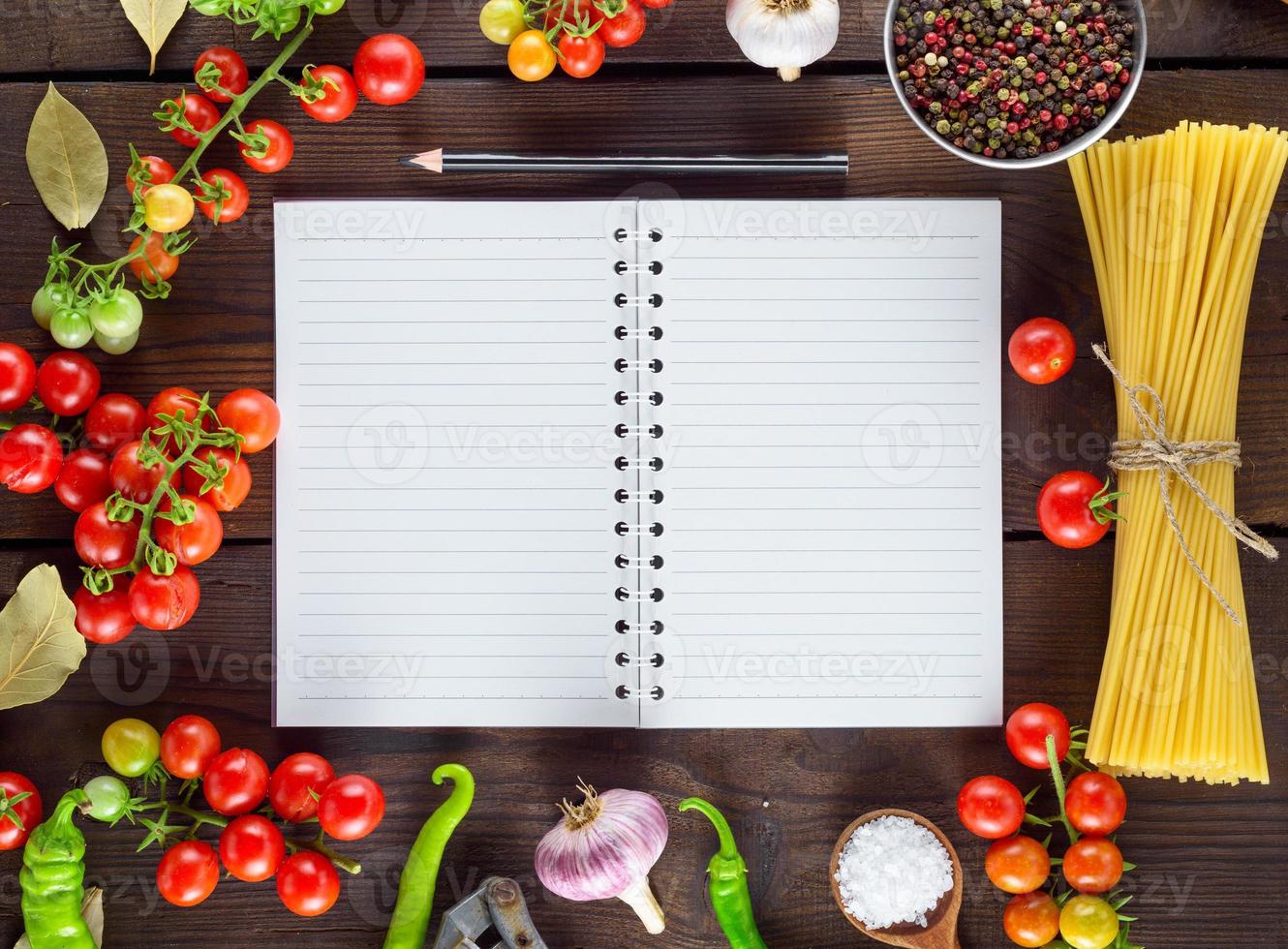 notebook in a line  and ingredients for cooking Italian pasta photo