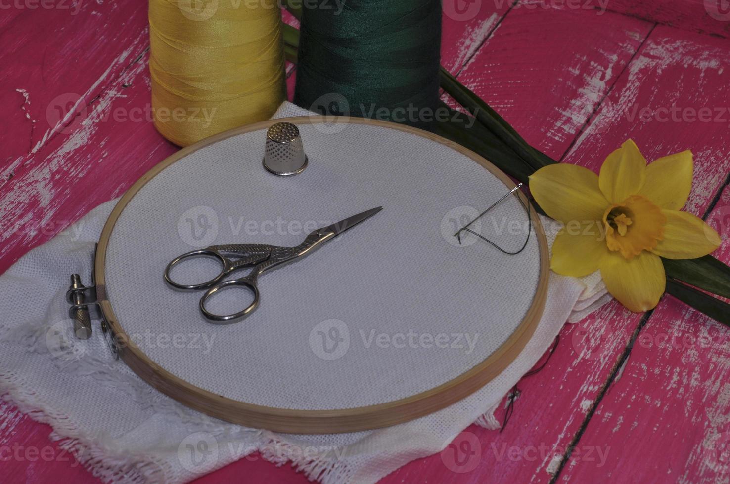 fabric in the wooden embroidery hoop for hand photo