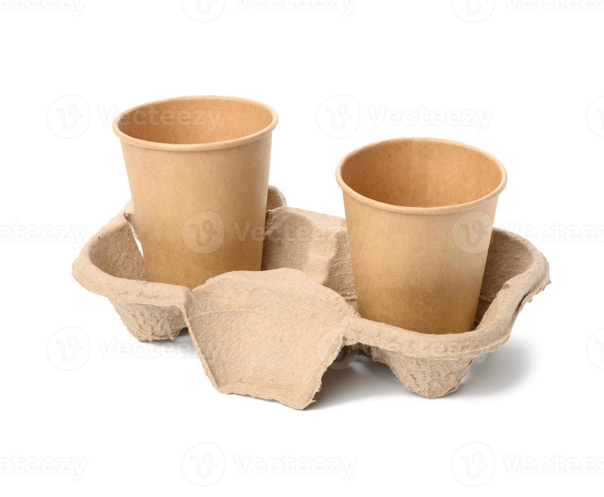two browne paper disposable cups stand in the tray, white background photo