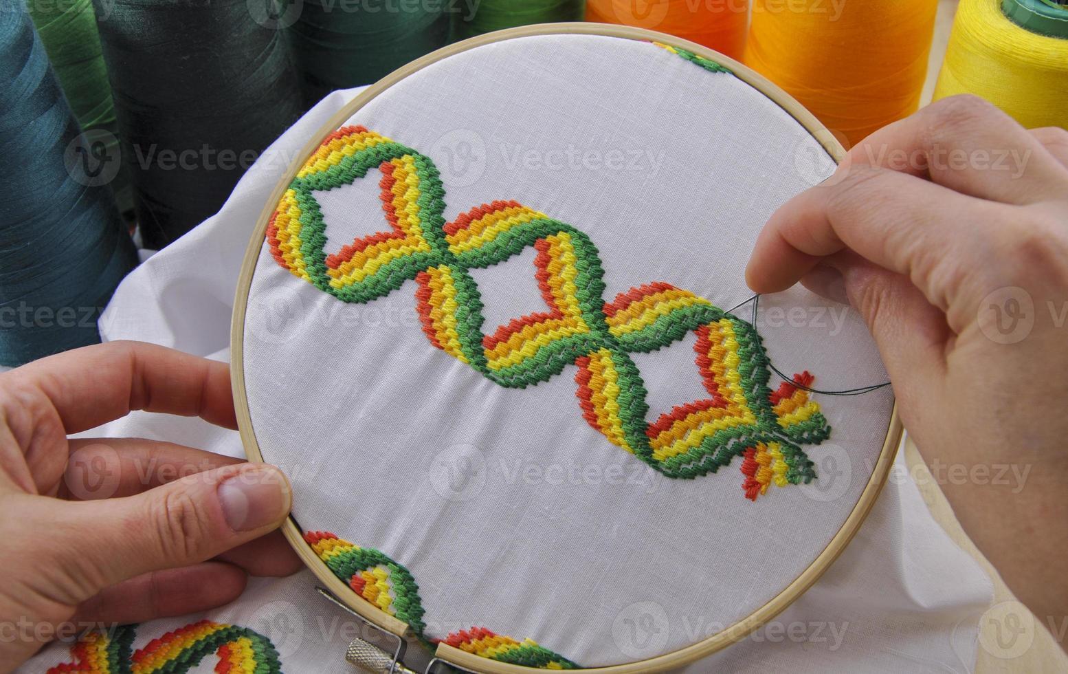 hoop with retro embroidered on the fabric photo