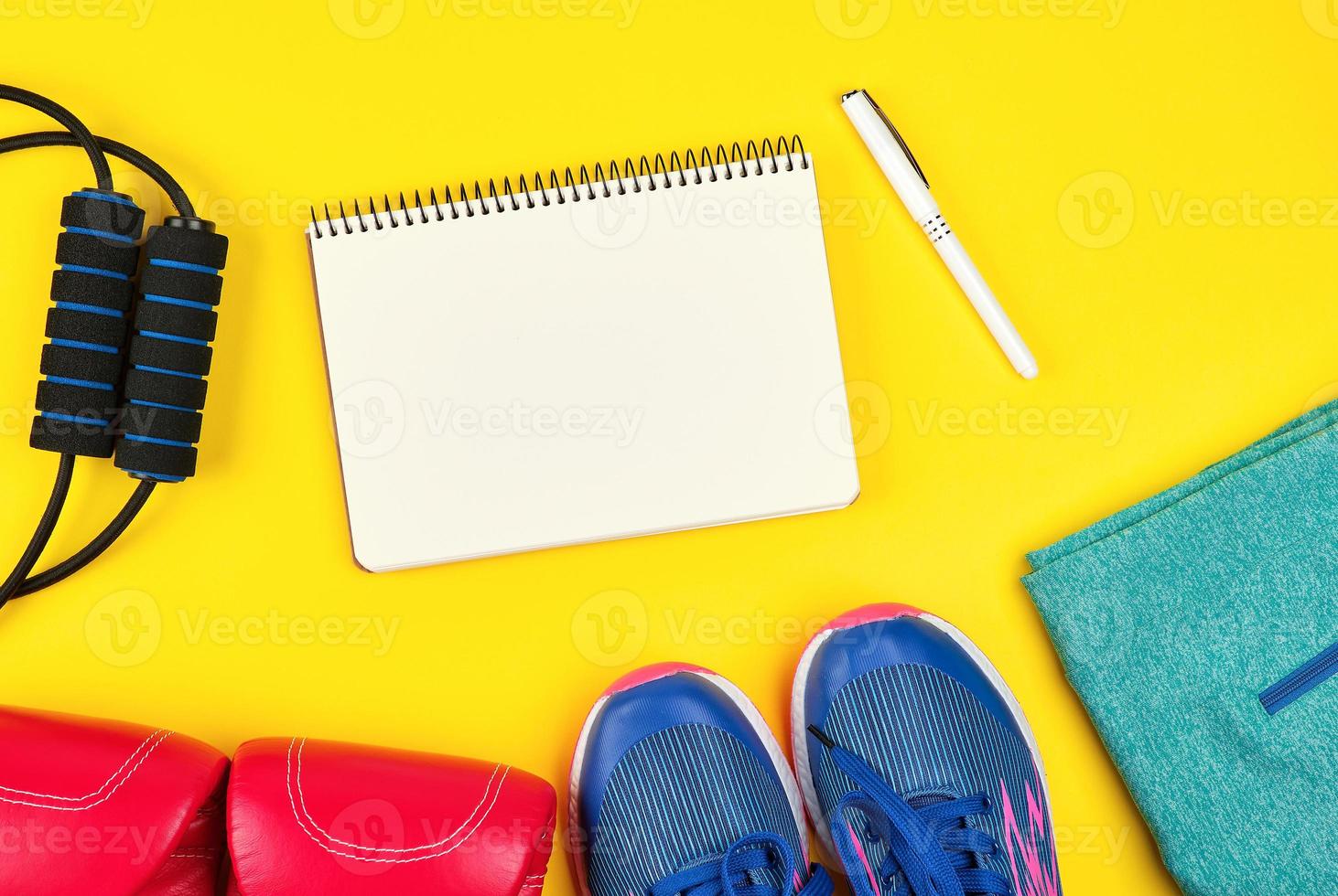 open empty notebook and sports women's clothing for sports and fitness photo