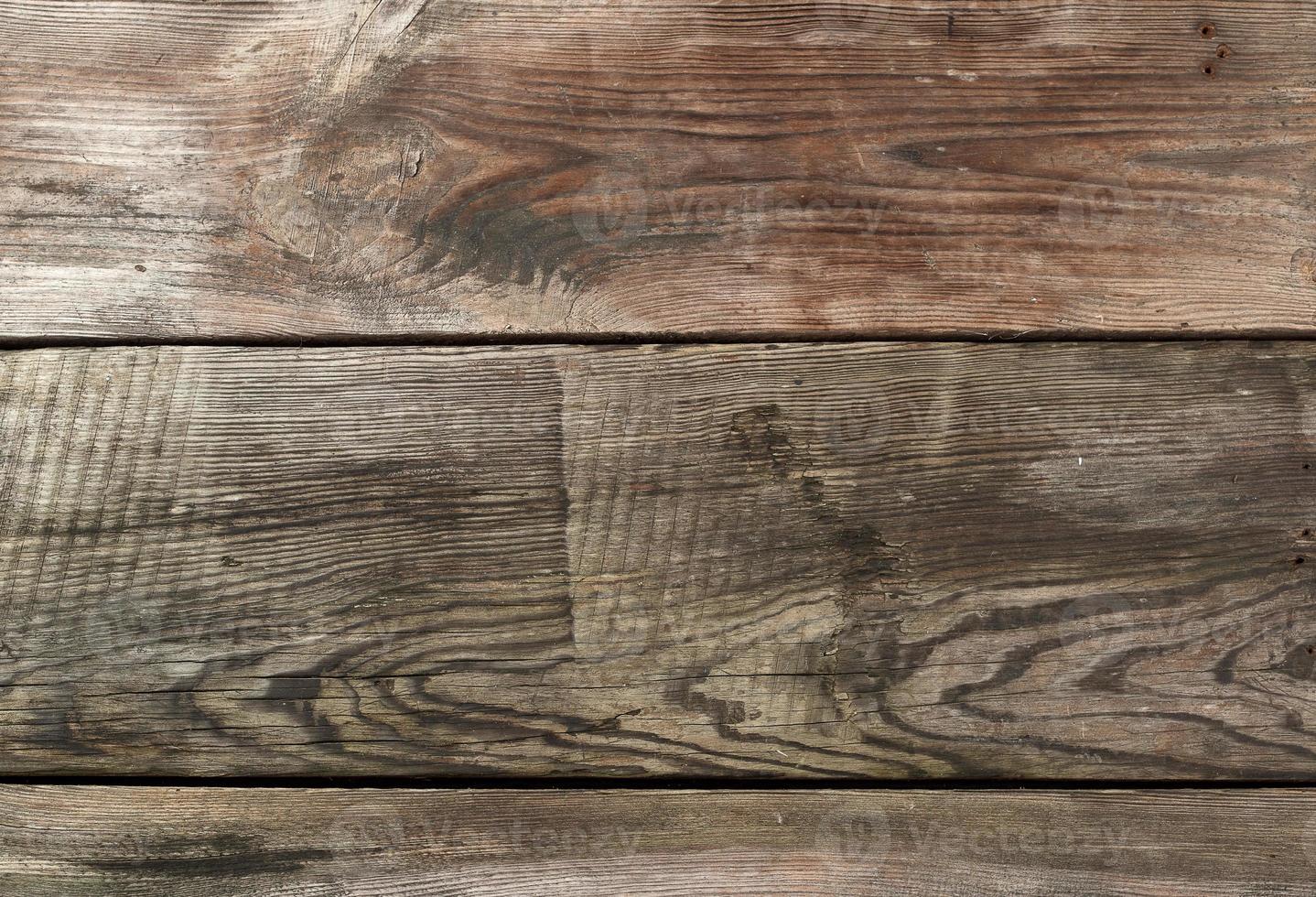 gray wooden background from parallel old pine boards photo