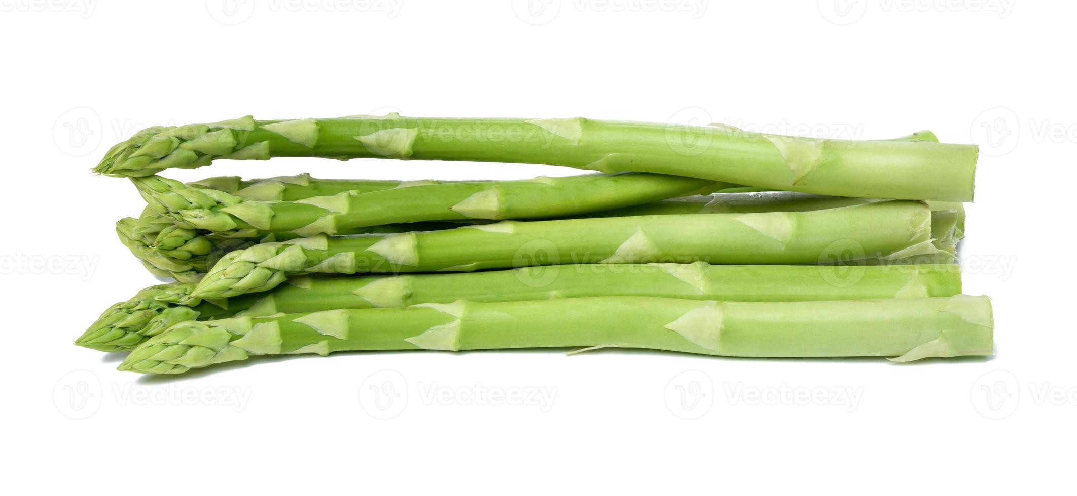 bunch of fresh raw asparagus on white isolated background photo