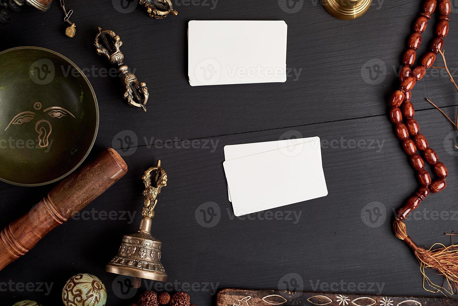empty white business cards in the midst of Asian religious objects photo