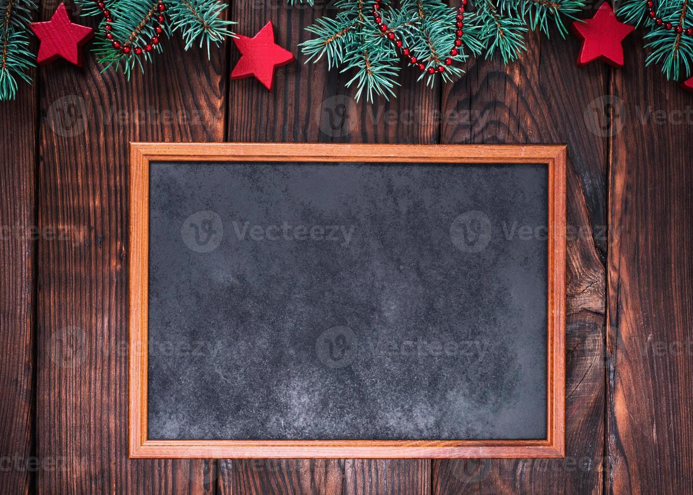 empty wooden frame on a brown background of boards photo