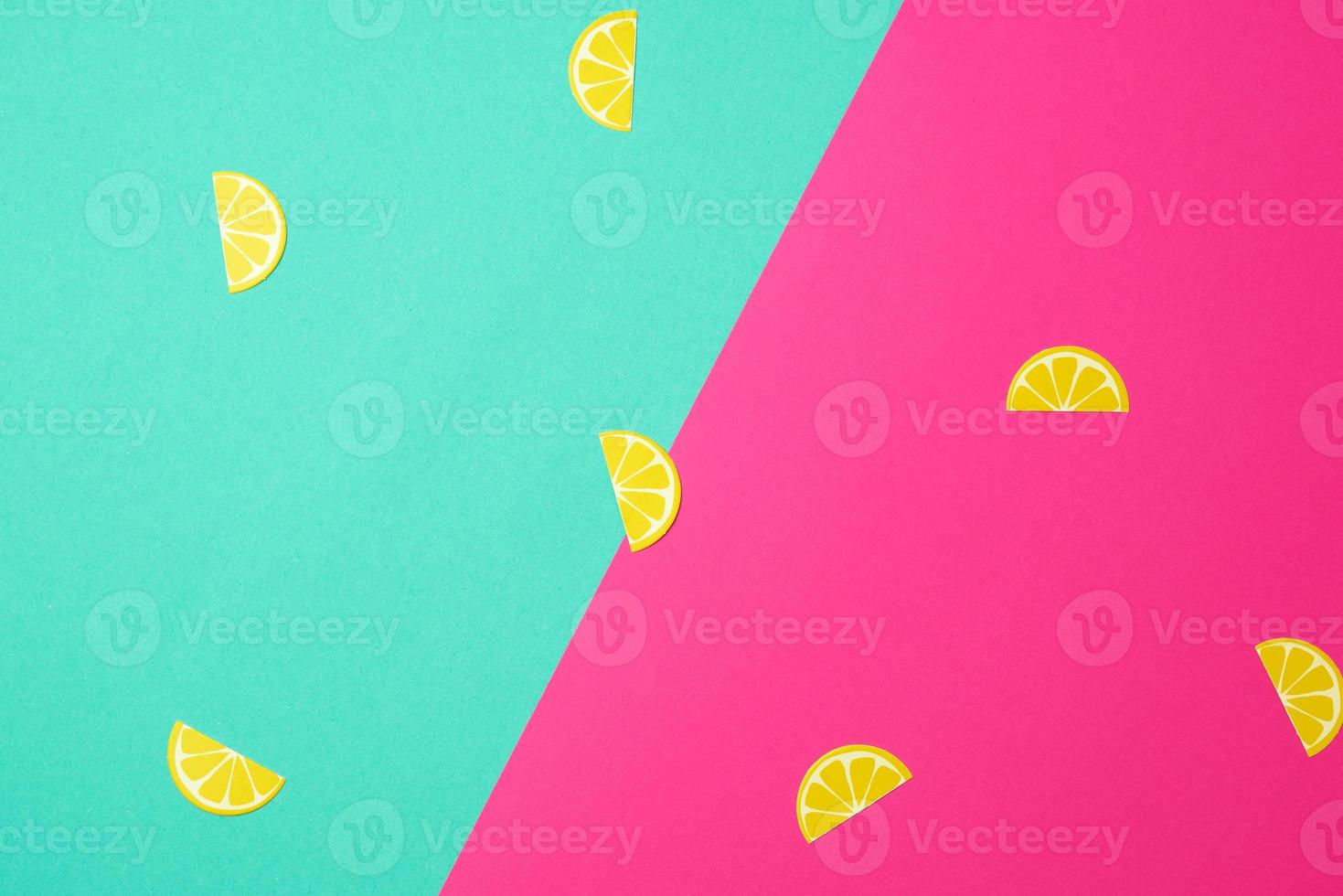 abstract green-pink background with paper yellow lemon slices photo