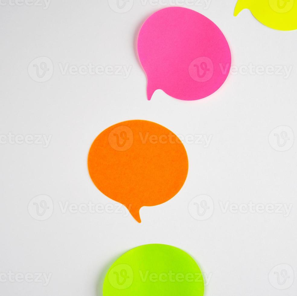 multicolored paper stickers on a white background photo