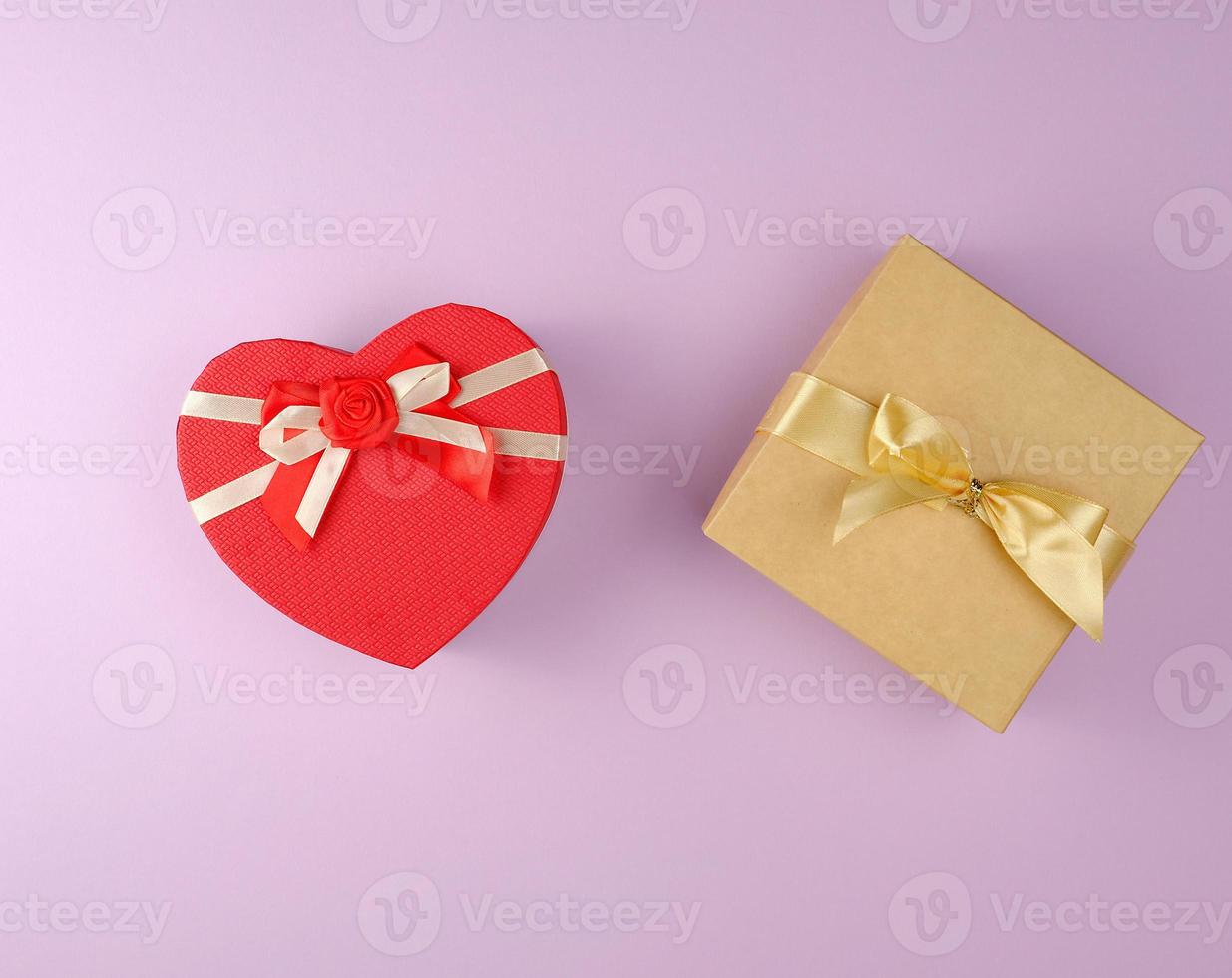 two cardboard holiday boxes on a purple background photo