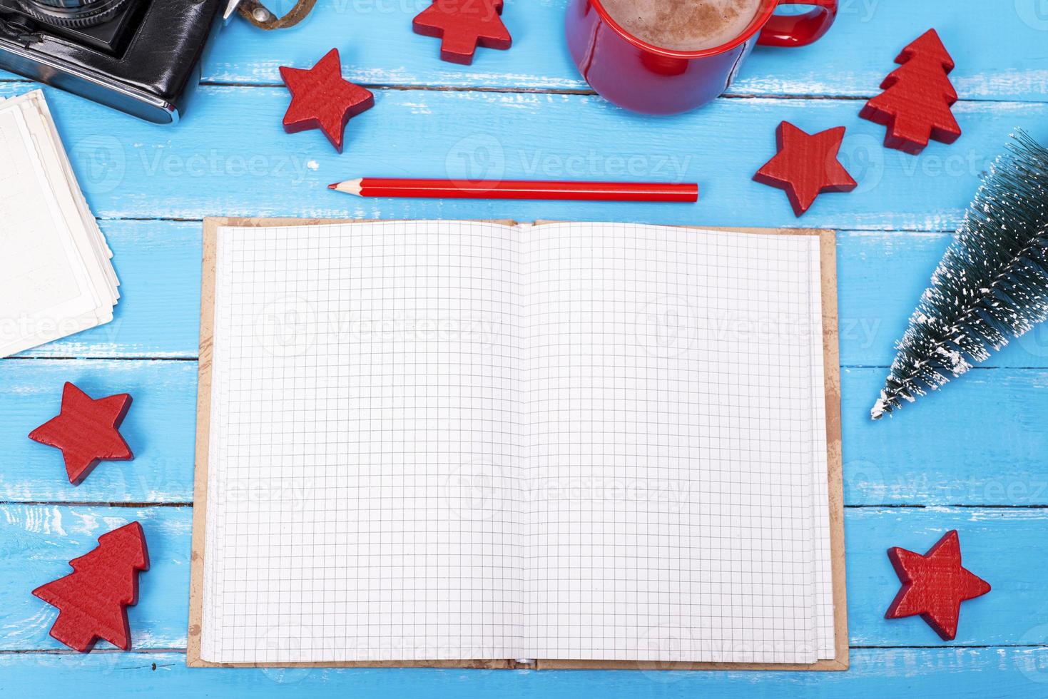open blank notebook with a red pencil photo