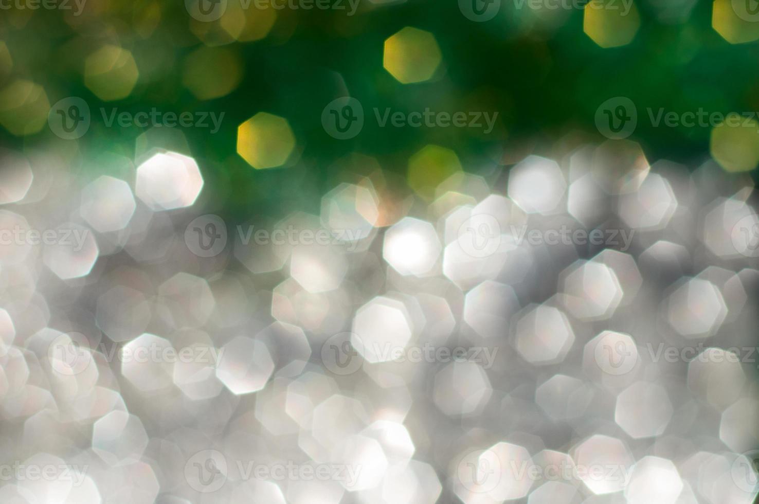 Abstract blurred background with silver and green bokeh photo