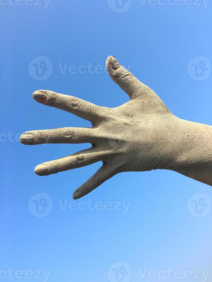 Women's human left hand in the splayed fingers photo