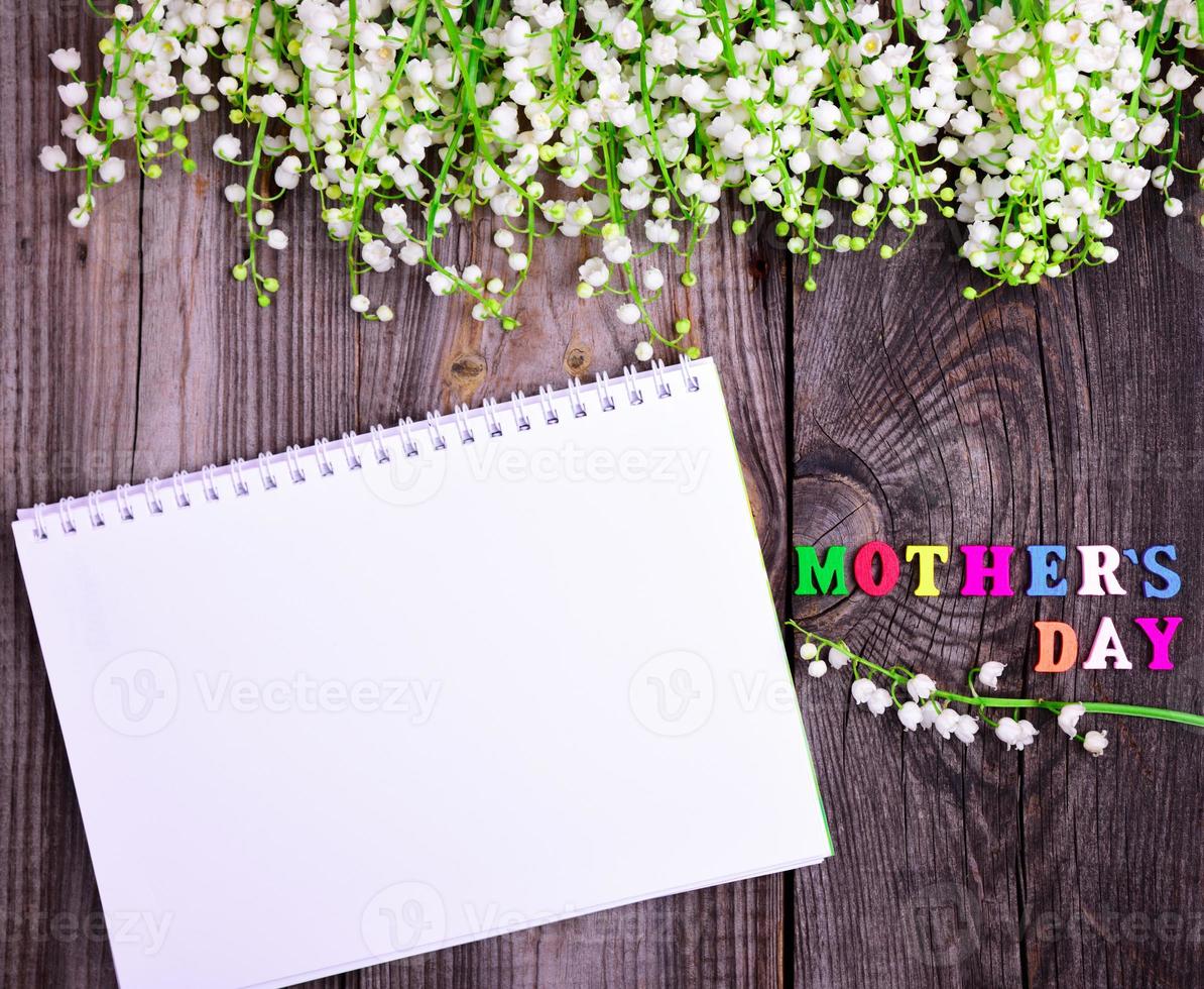 notebook and a congratulatory inscription with a mother's day photo