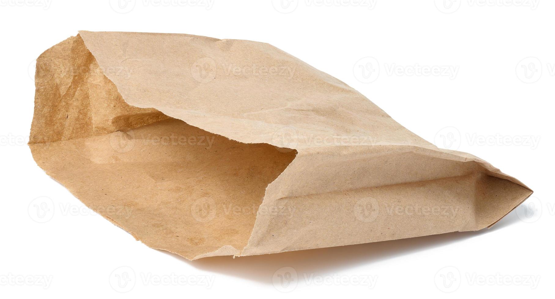 Empty brown paper bag for food on a white isolated background photo