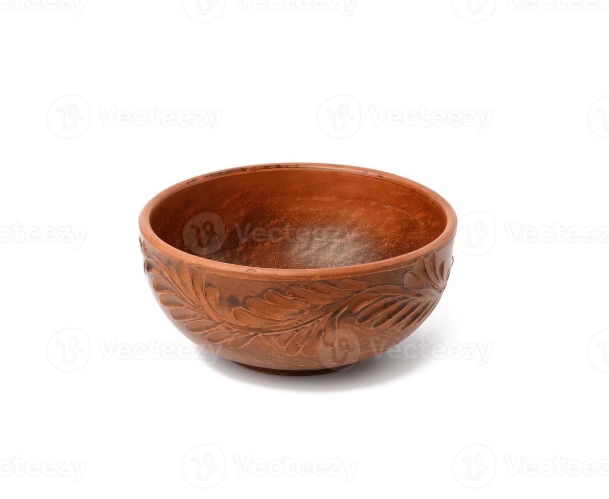 empty brown ceramic plate isolated on white background photo