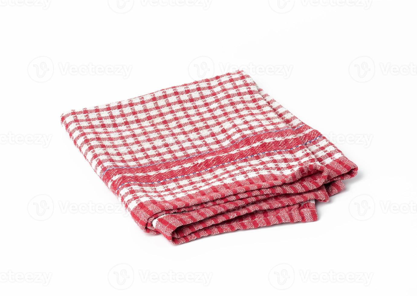 folded cotton red white checkered napkin on a white background photo