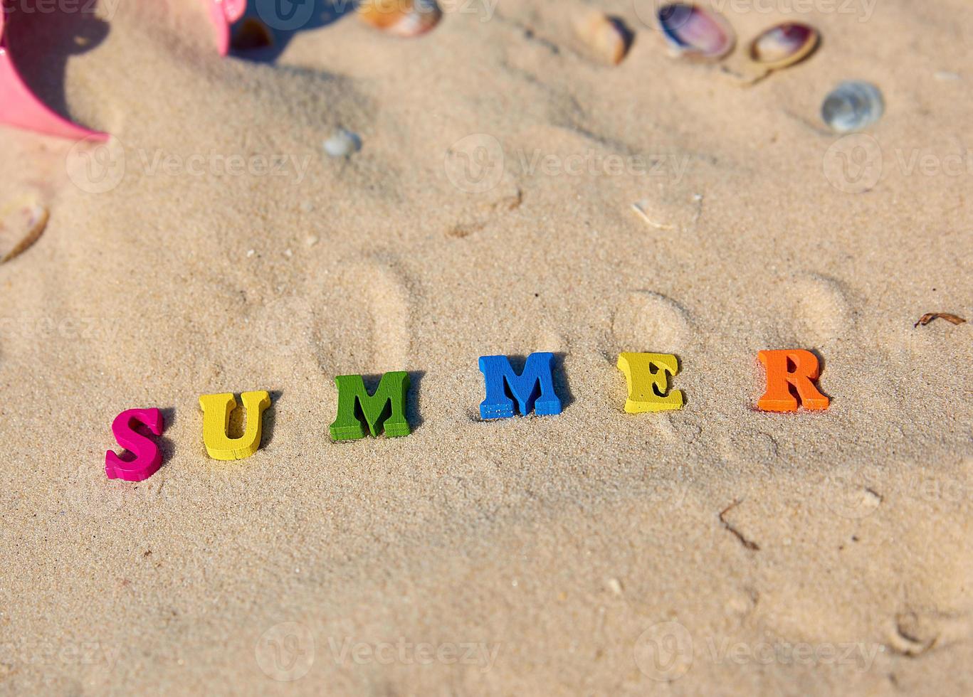 inscription summer from multi-colored wooden letters photo