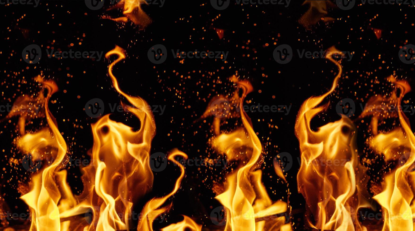 orange and yellow flames with sparks photo