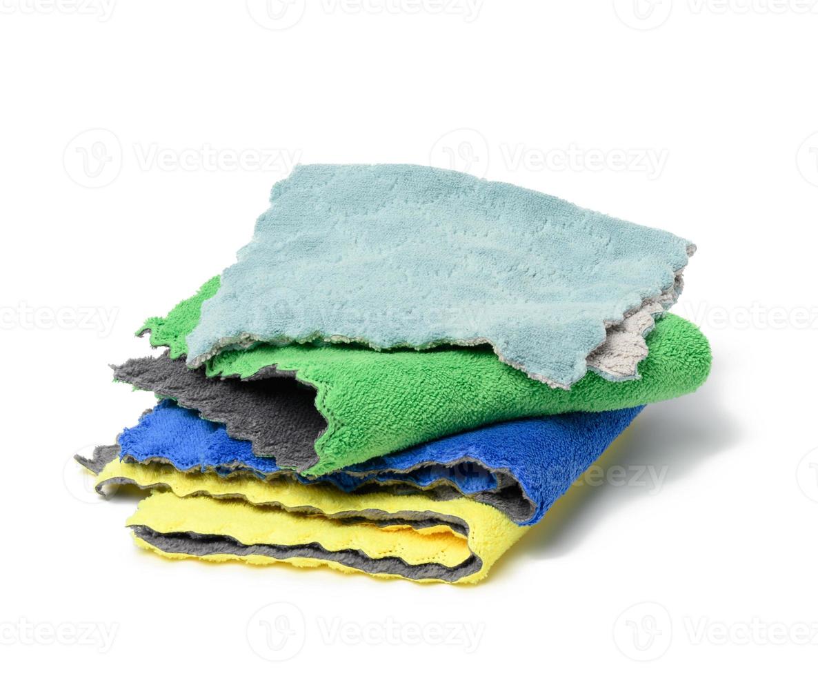 stack of textile multicolored rags for cleaning on a white background photo