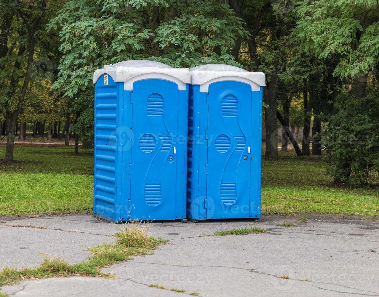 Two blue booths of the biotoilete photo