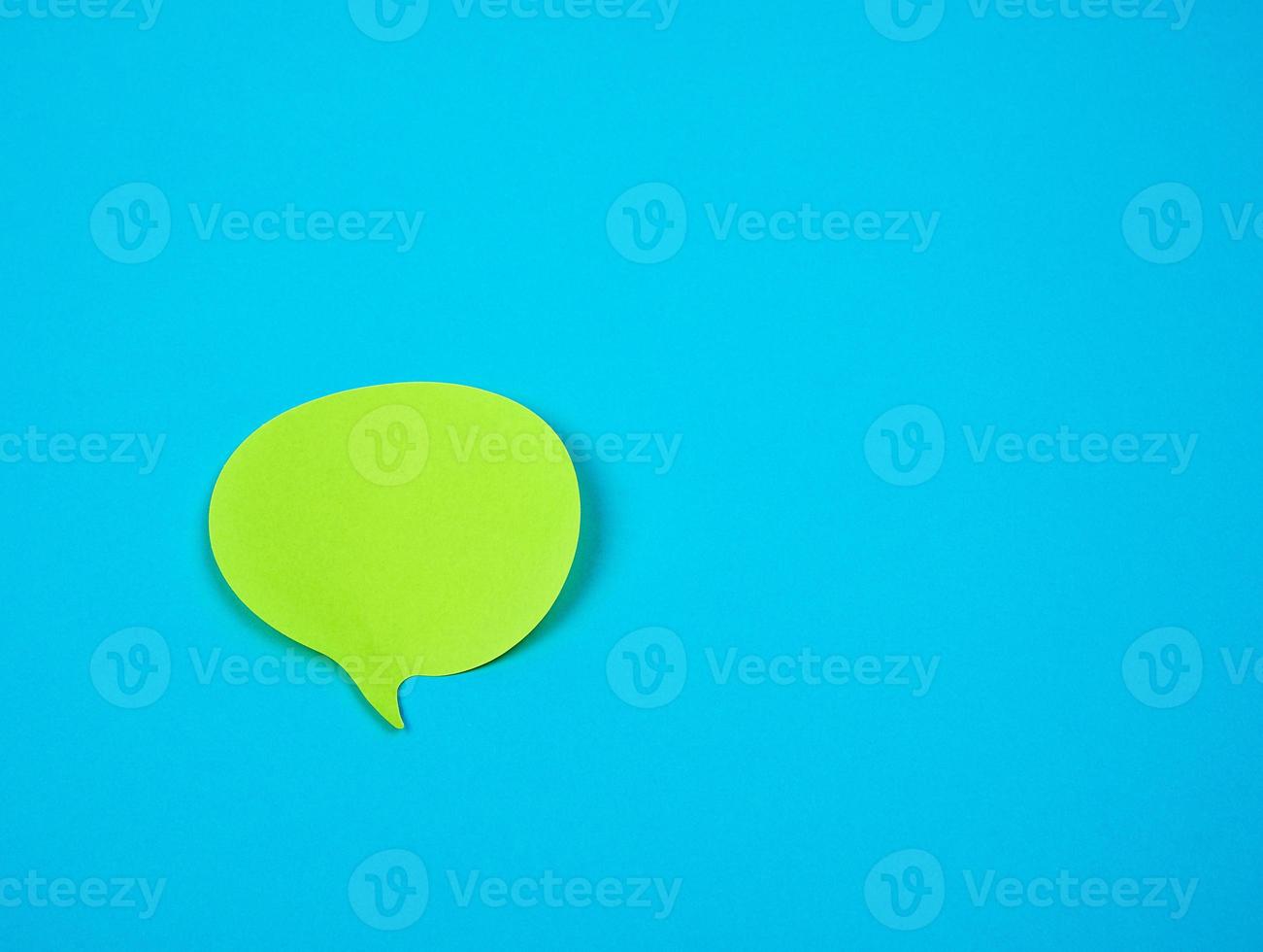 green sticker in the shape of a cloud on a blue background photo