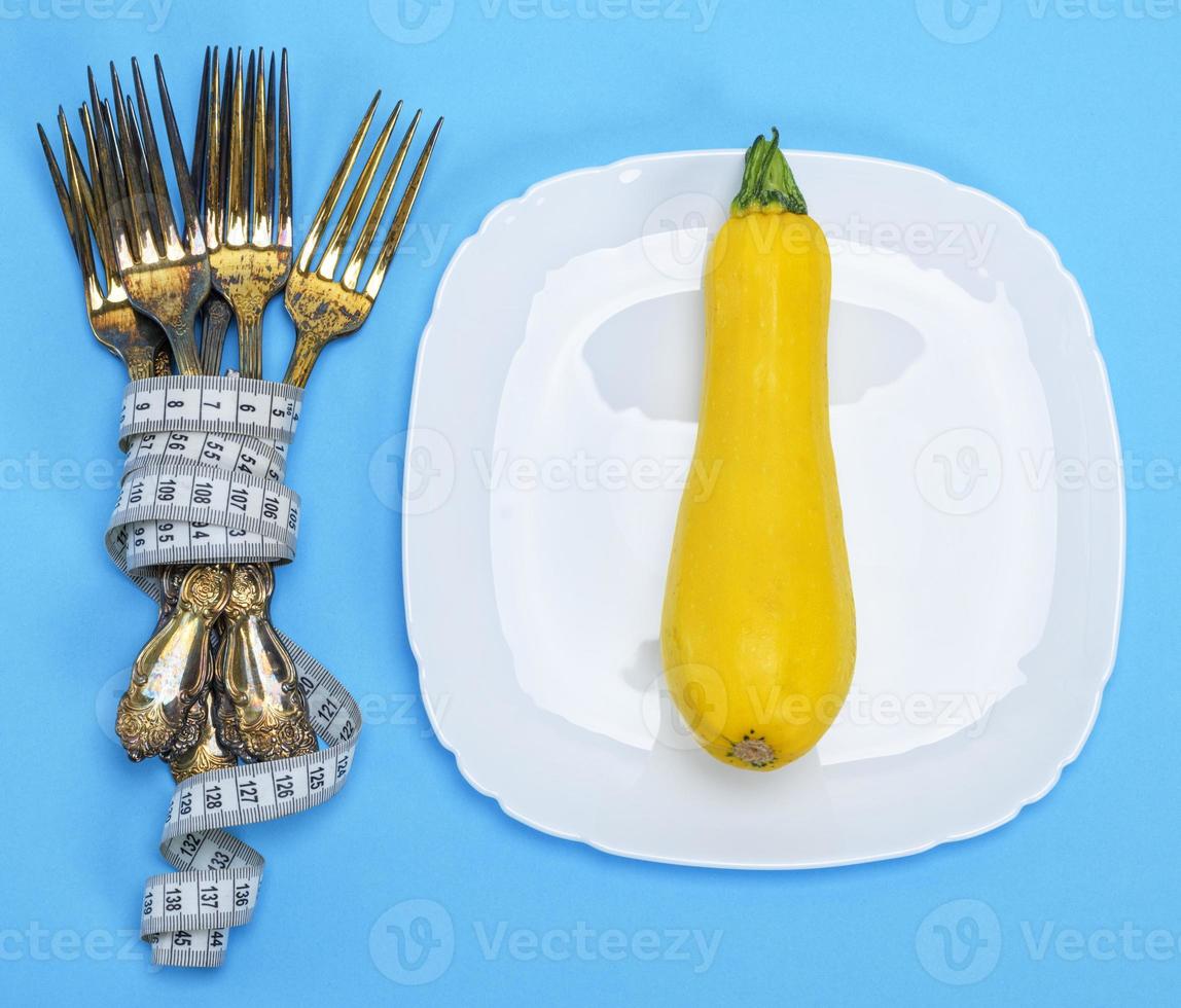 yellow squash on a white ceramic plate photo