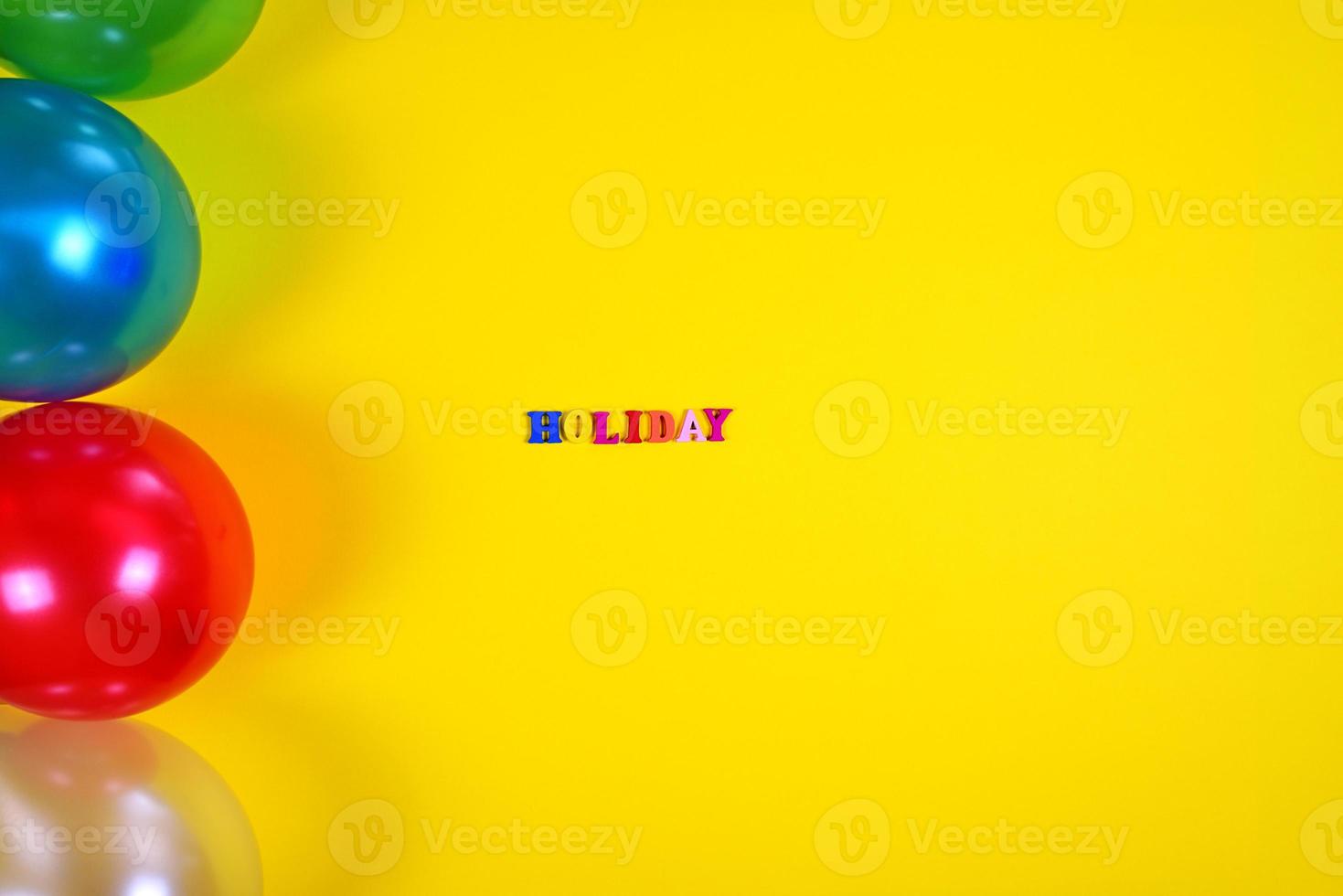 Abstract yellow background with balloons and inscription holiday photo