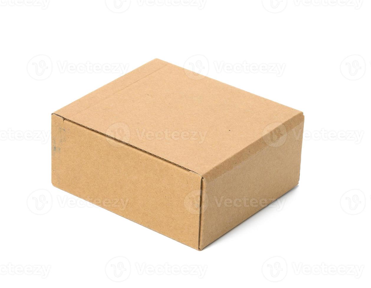 square box made of brown corrugated cardboard isolated on white background photo