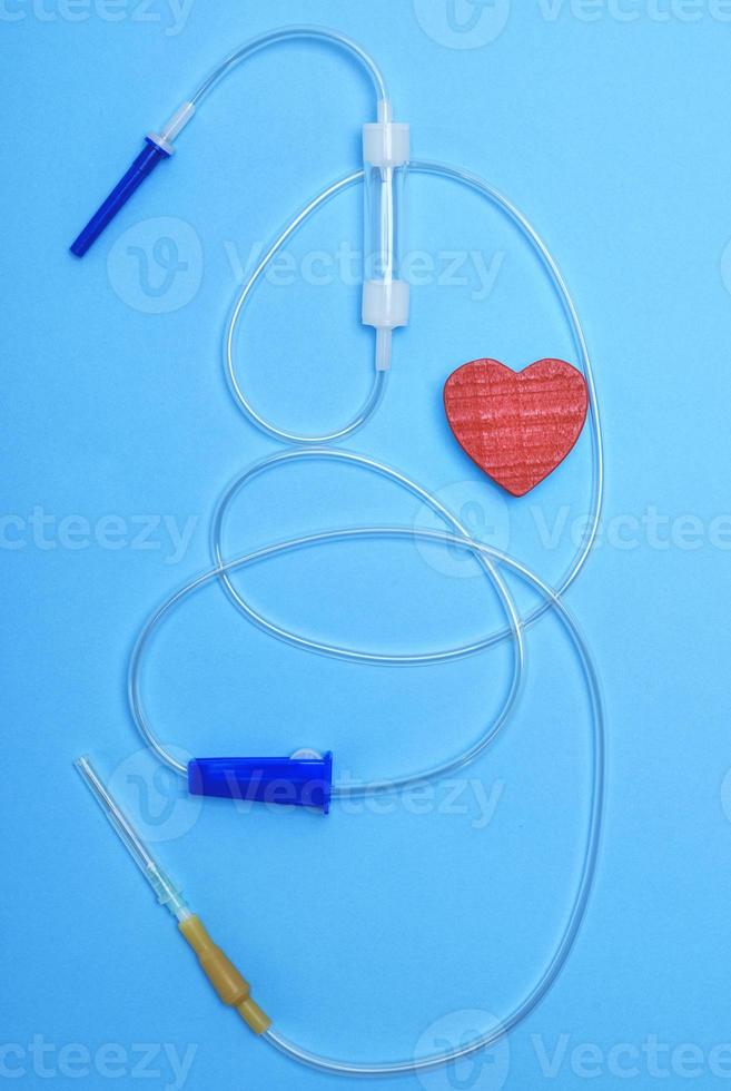 empty plastic dropper with needles and red heart photo