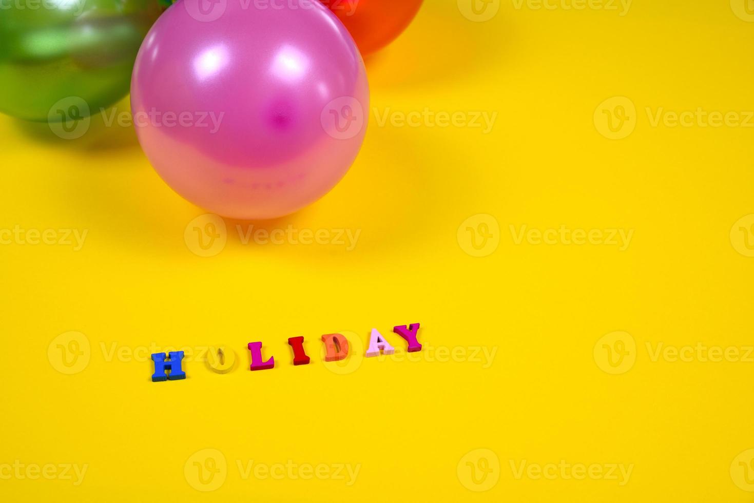 Abstract yellow background with holiday sign and balloons photo