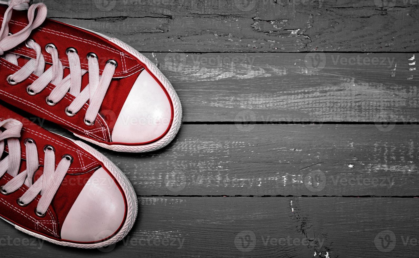 A pair of bright red textile sneakers photo