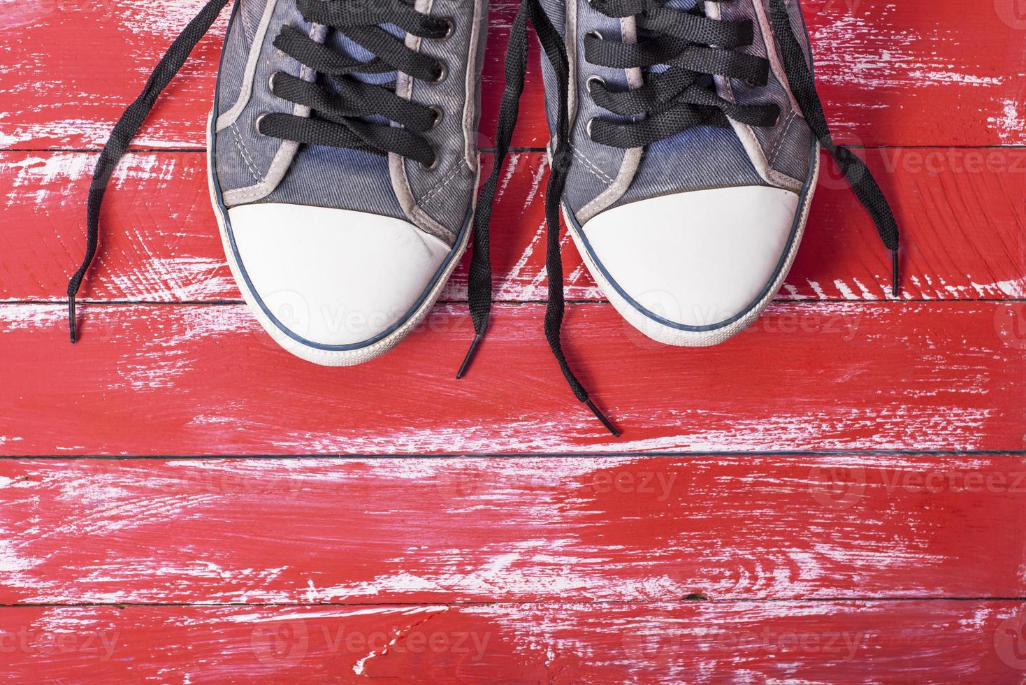 pair of old blue worn textile shoes photo