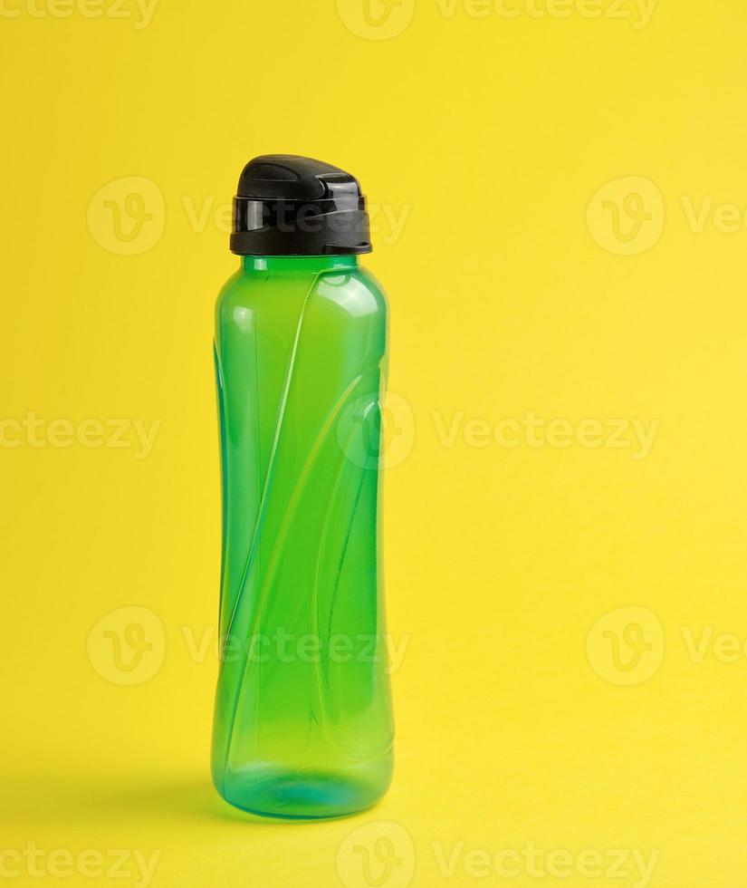 closed plastic green transparent sports bottle photo