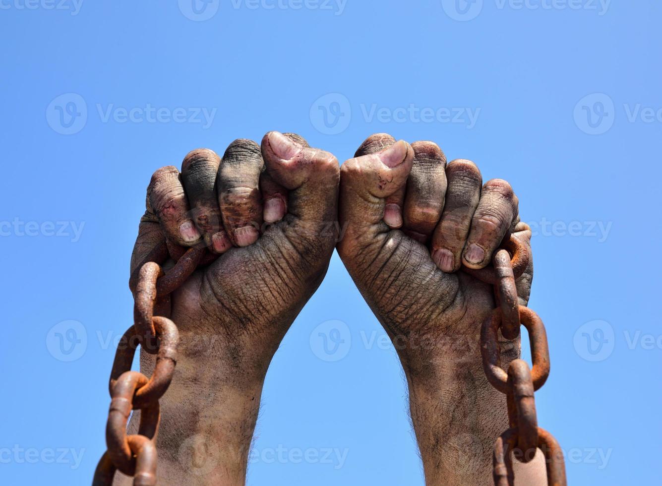 Two male hands are raised up photo