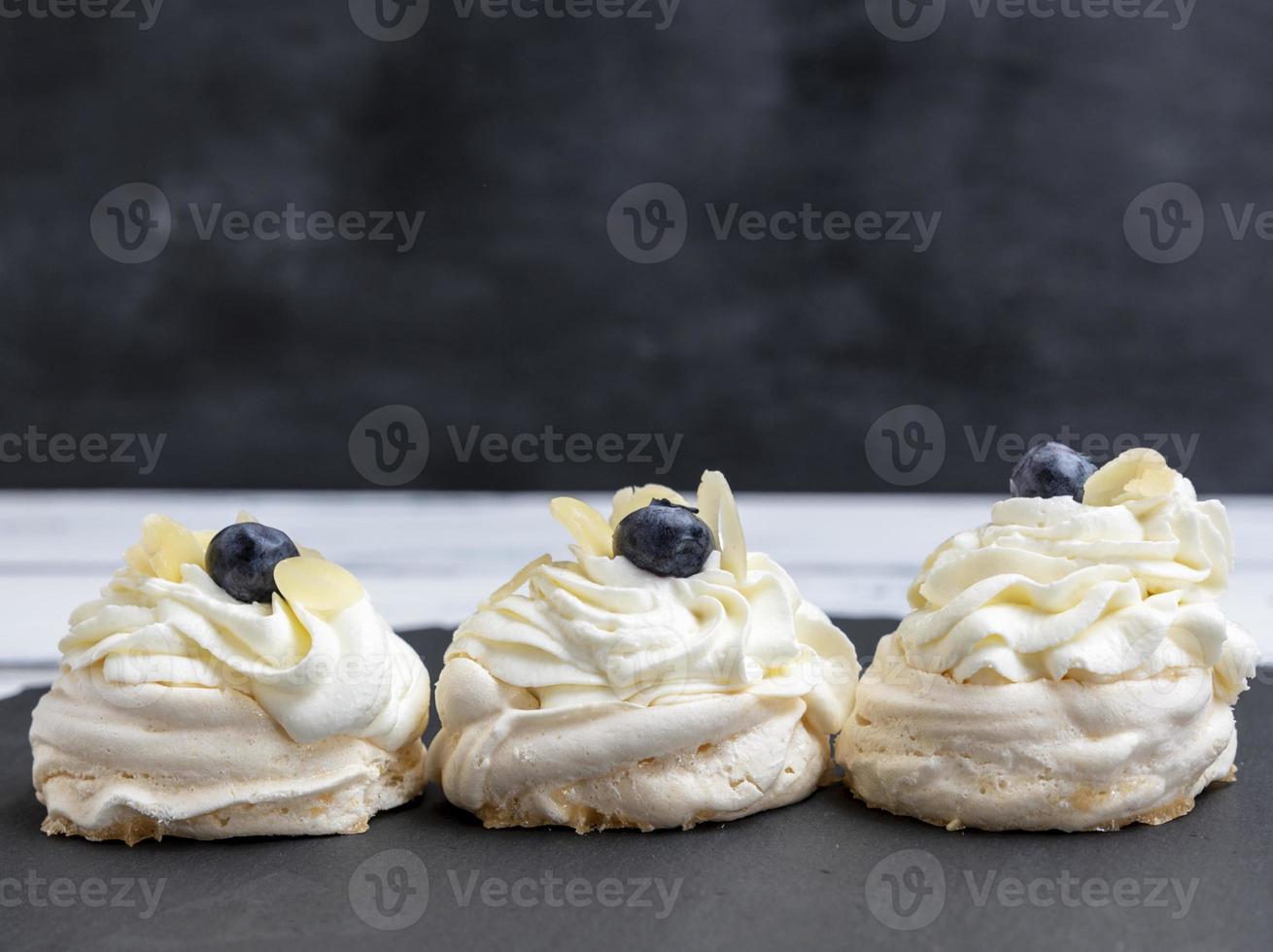baked round meringues with whipped cream 18956139 Stock Photo at Vecteezy