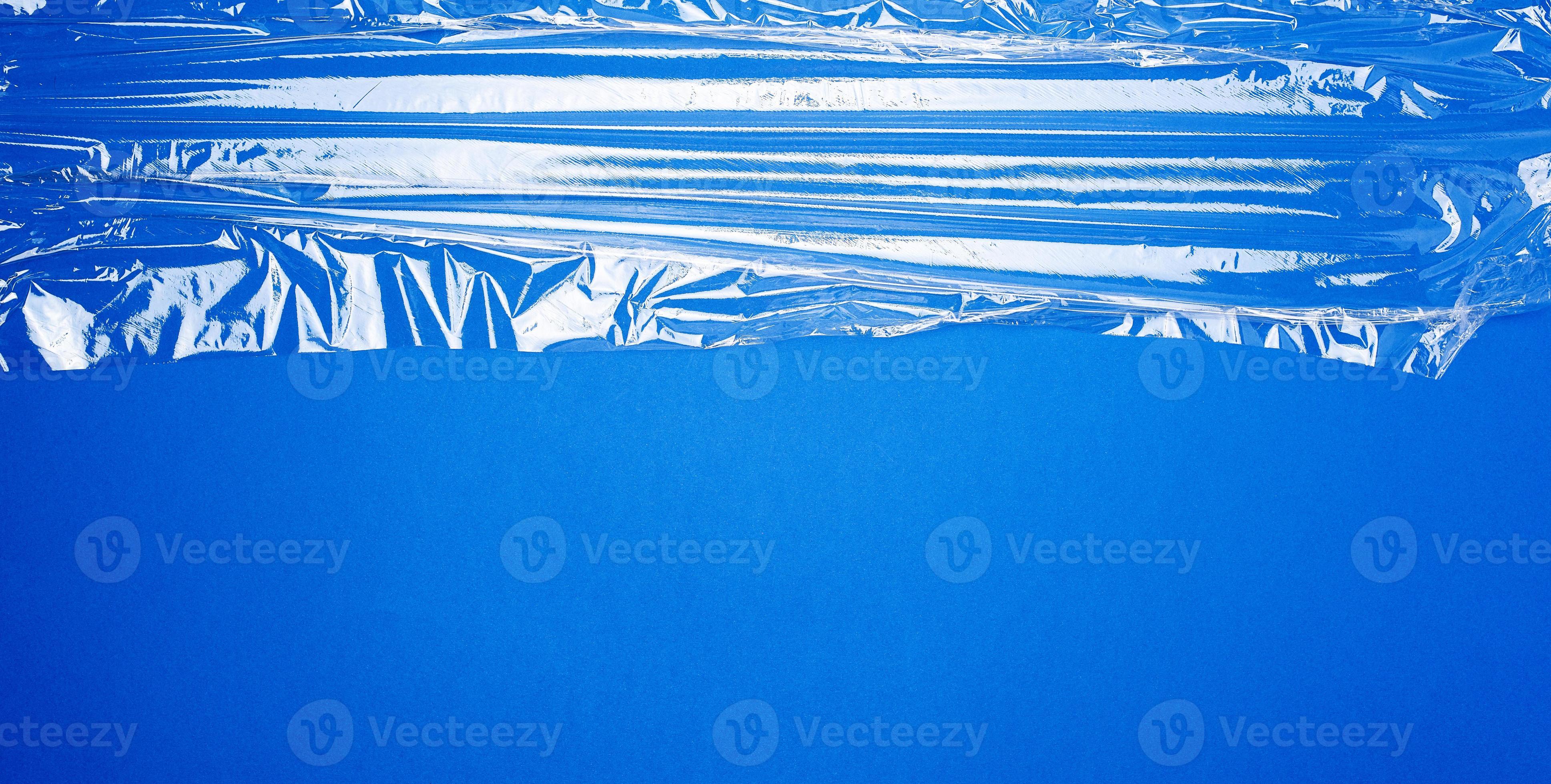texture of a transparent stretching plastic film for packaging products on  a blue background 18956159 Stock Photo at Vecteezy