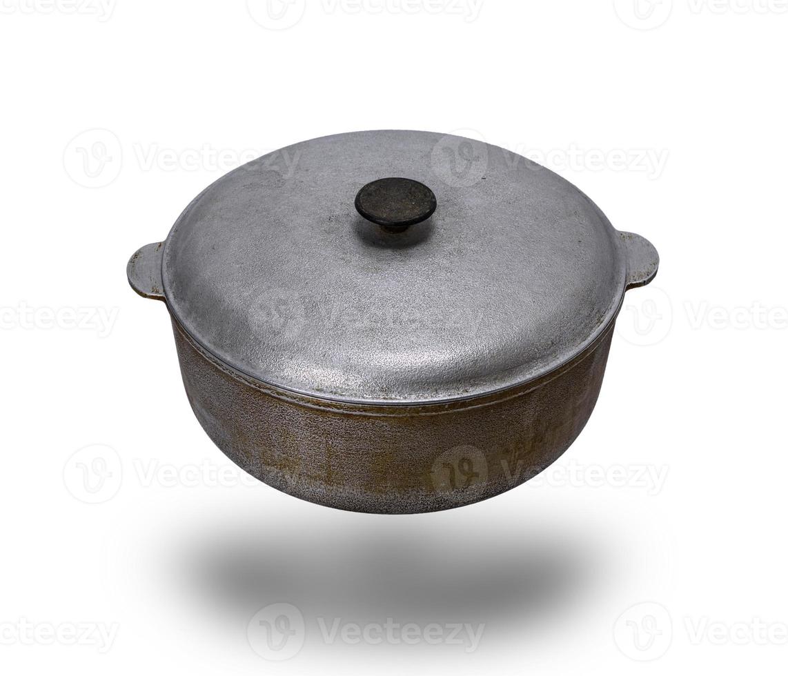 old used aluminum pan with a lid isolated on a white background photo