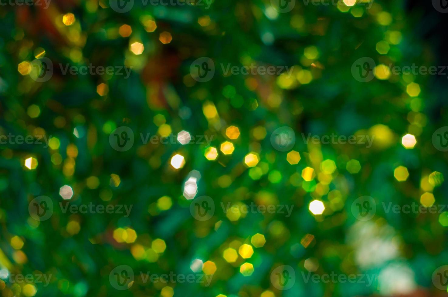 Green abstract background with yellow bokeh photo