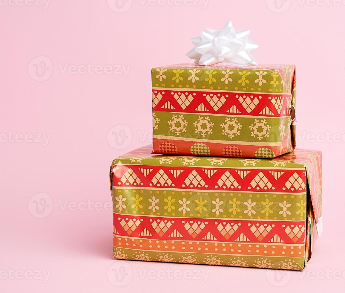 stack of colored paper wrapped gift boxes. great design for any purposes. photo