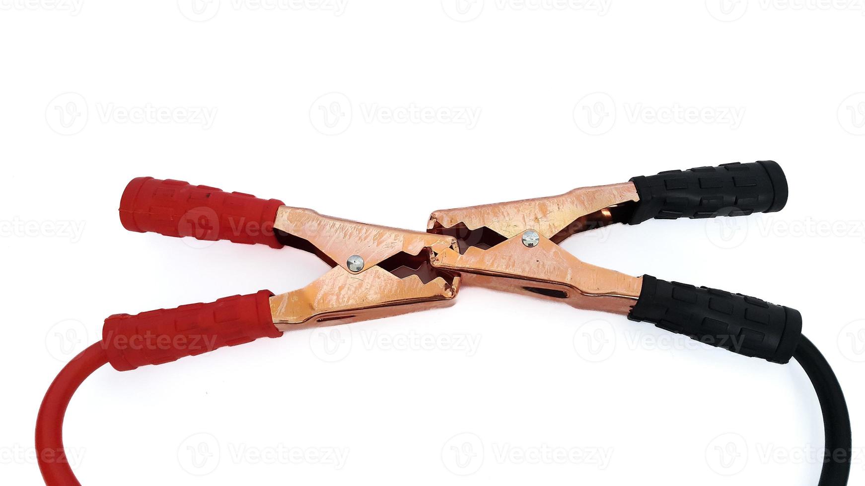 Red and black car battery jumper cable or booster cables isolated on white background photo